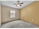 Bedroom featuring neutral carpet, a window, and a ceiling fan at 248 Copperdale Ln, Golden, CO 80403