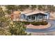 Charming home with large deck, manicured landscaping, and an inviting curb appeal in wooded neighborhood at 248 Copperdale Ln, Golden, CO 80403