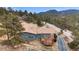Exterior elevation of a blue home with a gazebo-covered deck and paved driveway at 248 Copperdale Ln, Golden, CO 80403