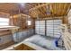 Exposed beam garage with room for two vehicles features two white garage doors at 248 Copperdale Ln, Golden, CO 80403