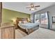 Bedroom featuring a wooden bed frame with side table and large windows at 248 Copperdale Ln, Golden, CO 80403