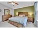 Bedroom featuring a wooden bed frame with a side table and a large window at 248 Copperdale Ln, Golden, CO 80403