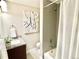 Clean bathroom featuring a shower-tub combination, granite vanity, and modern fixtures at 4816 W 8Th Ave, Denver, CO 80204