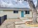 Charming single-story home with a blue front door and a well-maintained front yard at 4816 W 8Th Ave, Denver, CO 80204