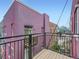 A private wooden balcony showcasing the building's exterior, neighborhood surroundings, and cityscape at 2501 15Th St # 3D, Denver, CO 80211