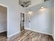 Bedroom with hardwood floors, industrial ductwork, and a French door leading to other rooms at 2501 15Th St # 3D, Denver, CO 80211