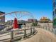 Picturesque view of a pedestrian bridge with modern architecture and art installations under a clear blue sky at 2501 15Th St # 3D, Denver, CO 80211