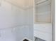 Walk-in closet with organized shelving and drawers, providing ample storage space and dark vinyl floors at 2501 15Th St # 3D, Denver, CO 80211