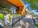 Exterior view of a restaurant building with wood siding, dark metal accents, and ample outdoor seating at 2501 15Th St # 3D, Denver, CO 80211