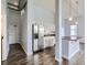 Stylish kitchen with stainless steel refrigerator and modern island with bar seating at 2501 15Th St # 3D, Denver, CO 80211
