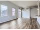 Spacious living area with plentiful natural light and sleek wood flooring at 2501 15Th St # 3D, Denver, CO 80211