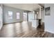 Expansive living room with balcony and modern kitchen island, enhanced by natural light at 2501 15Th St # 3D, Denver, CO 80211