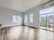 Open floor plan showcasing a bright living space with access to a balcony and city views at 2501 15Th St # 3D, Denver, CO 80211