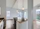 Cozy living area showcases a functional island and views through bright windows at 2501 15Th St # 3D, Denver, CO 80211