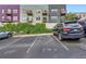Exterior view of a parking lot for a multi-story building with car parked in lot at 2501 15Th St # 3D, Denver, CO 80211