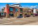 Exterior view of a brick building with multiple entrances and parking along the street at 2501 15Th St # 3D, Denver, CO 80211