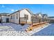 Spacious backyard deck with stairs, perfect for outdoor entertaining at 6829 Juniper Ct, Frederick, CO 80530