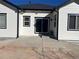 A clean backyard featuring a concrete patio and sliding glass door at 6829 Juniper Ct, Frederick, CO 80530