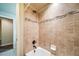 Clean bathroom with tub and shower, tile surround at 6829 Juniper Ct, Frederick, CO 80530