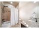 Clean bathroom with shower/tub combo and granite vanity at 6829 Juniper Ct, Frederick, CO 80530