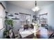 Charming dining room with wood table and large windows at 6829 Juniper Ct, Frederick, CO 80530