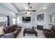 Living room with a fireplace, large TV, and comfortable seating at 6829 Juniper Ct, Frederick, CO 80530