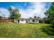 A well-manicured backyard with detached garage, perfect for outdoor entertainment at 1815 Ingalls St, Lakewood, CO 80214