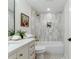 Stylish bathroom with a modern vanity, tiled shower, and decorative accents at 1815 Ingalls St, Lakewood, CO 80214