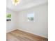 Inviting bedroom showcasing natural light from windows and contemporary lighting fixtures at 1815 Ingalls St, Lakewood, CO 80214