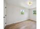 Bright bedroom with hardwood floors, two windows and white trim at 1815 Ingalls St, Lakewood, CO 80214