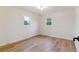 Bright room with hardwood floors and two windows providing plenty of natural light at 1815 Ingalls St, Lakewood, CO 80214