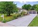 Beautiful home with an extra long driveway, detached garage, and well-manicured landscaping and garden at 1815 Ingalls St, Lakewood, CO 80214