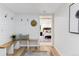 Inviting hallway with bench seating and view into the main bedroom at 1815 Ingalls St, Lakewood, CO 80214