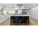 Bright, modern kitchen with white cabinets, a large island, and stainless steel appliances at 1815 Ingalls St, Lakewood, CO 80214