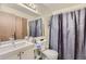 Standard bathroom with shower and lots of storage space with mirror on the wall at 18193 E Kentucky Ave # 203, Aurora, CO 80017