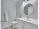 Clean bathroom with single vanity and updated toilet at 8457 S Hoyt Way # 206, Littleton, CO 80128