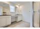 Clean bathroom with dual vanities, a shower, and modern fixtures at 2154 S Gold Bug Way, Aurora, CO 80018