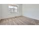 Cozy bedroom with neutral carpet and a large window at 2154 S Gold Bug Way, Aurora, CO 80018