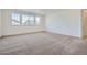 Spacious bedroom with neutral carpet and multiple windows at 2154 S Gold Bug Way, Aurora, CO 80018
