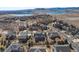Aerial view of a residential neighborhood with mountain and lake views at 7765 Yankee Ct, Arvada, CO 80007