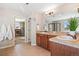 Bathroom with dual vanities and walk-in closet at 7765 Yankee Ct, Arvada, CO 80007