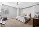 Comfortable bedroom with neutral decor, a plush bed, and soft carpeting at 7765 Yankee Ct, Arvada, CO 80007