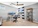 Bright bedroom featuring built-in shelving, neutral colors, and a large window at 7765 Yankee Ct, Arvada, CO 80007