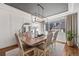 Elegant dining room with modern lighting, stylish decor, and a large window at 7765 Yankee Ct, Arvada, CO 80007