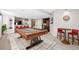 Finished basement game room with pool table, bar, and seating area at 7765 Yankee Ct, Arvada, CO 80007