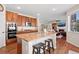 Spacious kitchen with granite counters, stainless appliances, and hardwood floors at 7765 Yankee Ct, Arvada, CO 80007