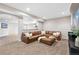 Cozy living room with leather sectional, neutral tones, and recessed lighting at 7765 Yankee Ct, Arvada, CO 80007