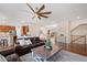 Open-concept living area with hardwood floors, comfortable seating, and seamless flow to the kitchen at 7765 Yankee Ct, Arvada, CO 80007