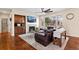 Cozy living room featuring a fireplace, comfortable seating, and large windows for ample natural light at 7765 Yankee Ct, Arvada, CO 80007