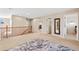 Spacious upper-level hallway featuring a carpeted floor and open access to rooms at 7765 Yankee Ct, Arvada, CO 80007